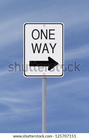 One way sign against a blue sky background