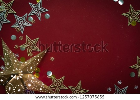 Christmas and New Year holidays background. Diferent stars on red background.