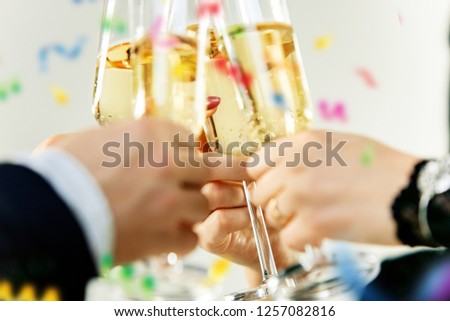 Celebration. Hands holding the glasses of champagne and wine making a toast. The party, celebration, alcohol, lifestyle, friendship, holiday, christmas, new, year and clinking concept