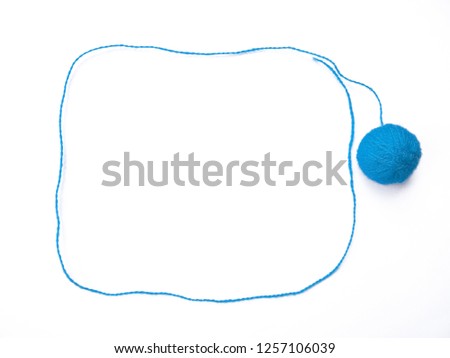 Background of wool yarn, knitted yarn, can also be used as a yarn frame. Blue knitting yarn for handicrafts isolated on white background.