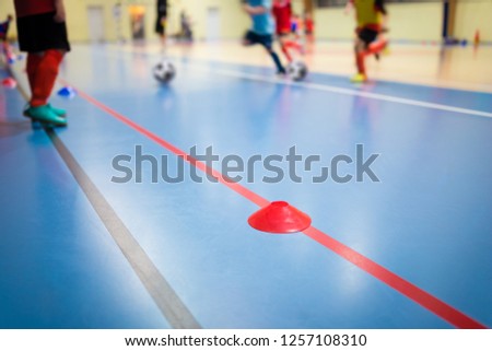 Group of Kids Training Indoor Soccer Futsal. Children Physical Education Class. Gym Class for Youth. Futsal Training Picture with Blurred Background