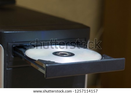 Open dvd rom on computer closeup with disk