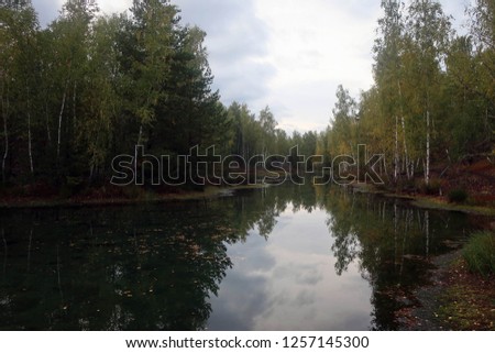 Scenic autumn landscape with forest and lake near Tula, Russia