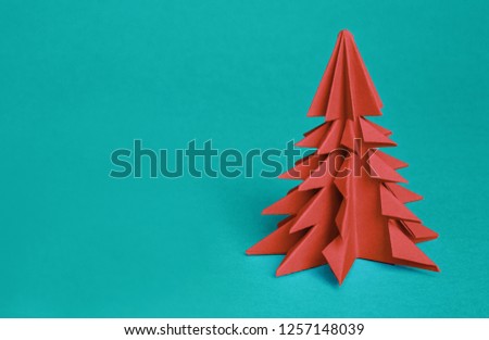 Chinese Zodiac Sign Year of Pig. green origami paper tree and white pig symbol of 2019, on a red background, free space for text, minimalism. Happy New Year 2019 year