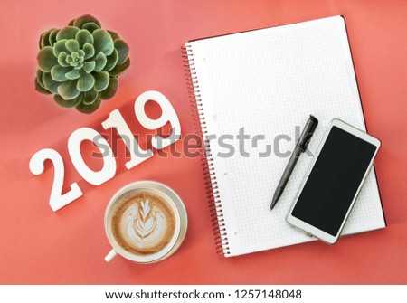 Happy New Year's FLAT LAY 2019 notepad, free space for text. Christmas decorations. Goals for the new year. mockup phone