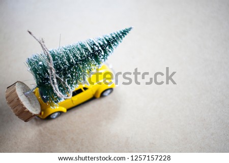 christmas tree on yellow toy car