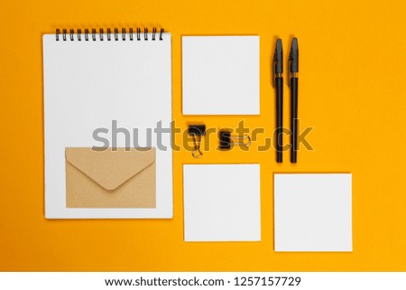 mock up concept. cards Papers on yellow background. Top view, flat lay, copy space