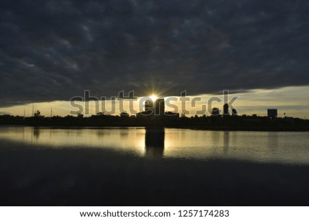 morning dark cloud reflection on water surface as background