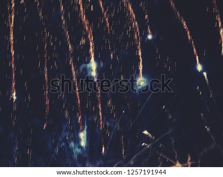 abstract, fireworks, blurred image. Christmas background. Light with glowing sparks, merry christmas