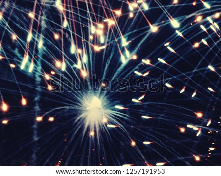abstract, fireworks, blurred image. Christmas background. Light with glowing sparks, merry christmas