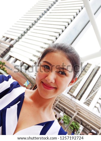 Beautiful woman happy take photo selfie portrait and traveling in the city.	