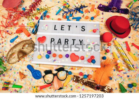 Lets Party greetings on a lightbox with party dekoration