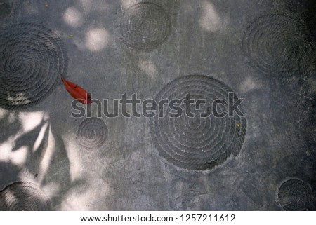 shadows on cement walkway, thailand