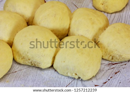 pieces of raw rich dough on a cutting board