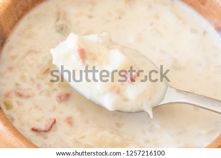 Clam chowder in a wooden dish
