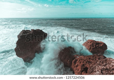 Breaking waves on rocks in Portugal
