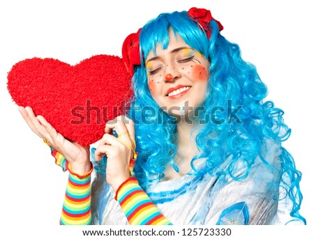 Clown girl holding heart. Isolated on white
