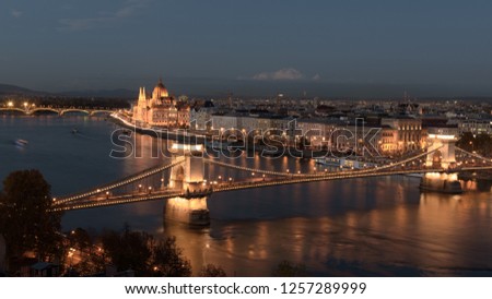 Panorama of the Hungarian Parliament, and the Chain bridge (Szechenyi Lanchid), over the River Danube, Budapest, Hungary, at night Royalty-Free Stock Photo #1257289999