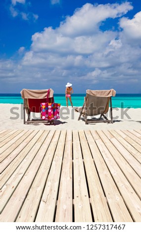 Beautiful Maldive terrace with bikini girl.