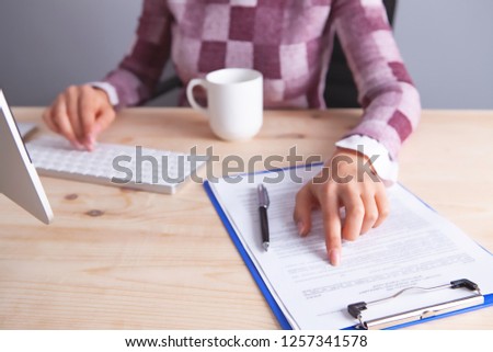 businesswoman keyboard documents coffee
