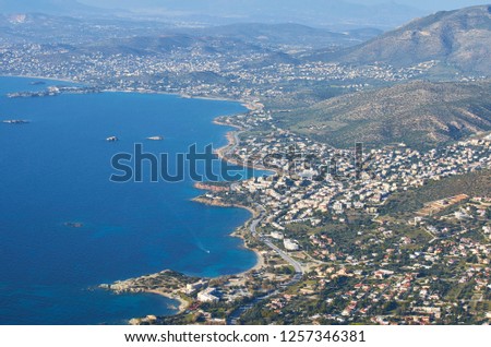 Aerial panoramic view of the Idyllic Eastern Attica near Athens, Greece. Amazing scenery against a deep blue sky over Eastern Attica. Aerial photography over Athens, Greece, Europe