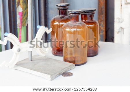 old brown glasses medicine on white floor background