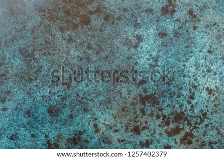 Texture grunge blue and black spotting background.