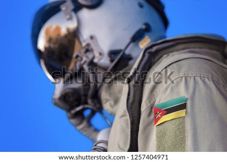 Air force pilot flight suit uniform with Mozambique flag patch. Military jet aircraft pilot