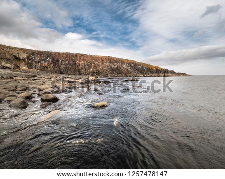 View Of Cullernose Point Near Howick, Northumberland Showing The Geology Of The Whin Sill Royalty-Free Stock Photo #1257478147