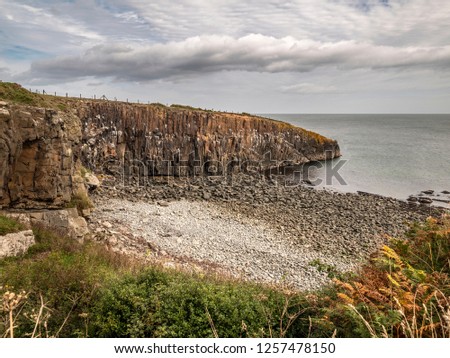 View Of Cullernose Point Near Howick, Northumberland Showing The Geology Of The Whin Sill Royalty-Free Stock Photo #1257478150