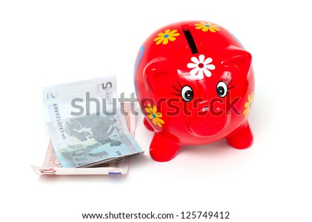 piggy bank and euros isolated on white background