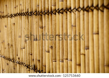 Natural bamboo fence with shallow depth of field
