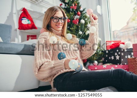 Portrait of beautiful woman enjoying Christmas eve/New Year.