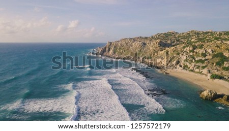 Aerial view beautiful of sea waves from drone. Stock image picture of blue color ocean water, wave, sea surface. Top view on turquoise waves, clear water surface texture. Top view, amazing nature back
