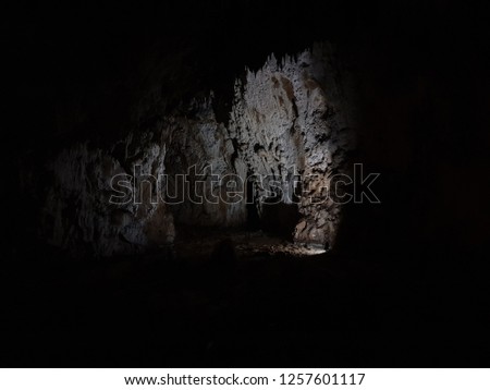 Inside cave. Photo of a dark cave, ideal for tourism. Exploring cave in Bosnia, Europe
