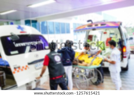 Blurred picture of nurse take care of the patient in ambulance. The patient have had accident and suffer from head injury. - Image
