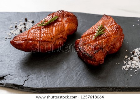 grilled duck breast on black slate plate