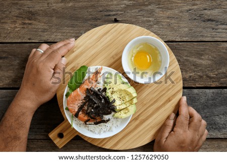 Shrimp Sashimi Rice Poke bowl with Avocado Clean and balanced healthy food concept.on dark wooden background, top view - Image