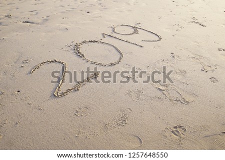 2019 numbering written on the beach. Happy new year 2019 concept.
