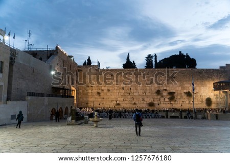 Unknowns peoples praying on the Western wall of the old city of Jerusalem on the morning.