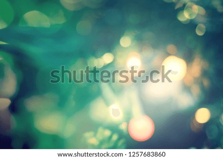 Happy new year 2019 concept: Abstract bokeh light bulb and blurred green christmas tree background