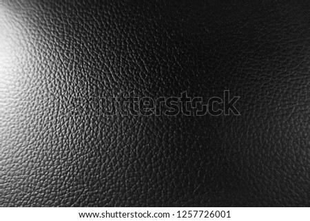 black leather sofa, pattern surface texture. Close-up of interior material for design decoration background