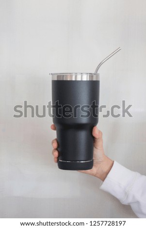 Hand on large water bottle for keeping temperature, stock photo