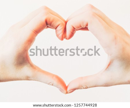 Heart shape with hand on white background. top view. Female hands in the form of heart. Hands in shape of love heart.Volunteering, love, kindness and friendship concept. Top view.