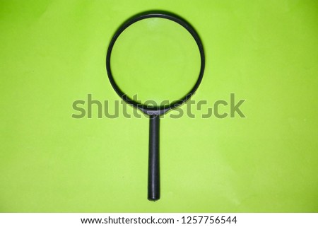Magnifying glass on green background green screen.