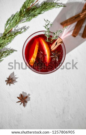 Cooking oranges in red wine with spices