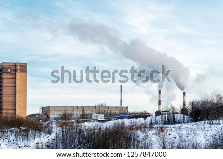 In front of us the outskirts Perm. Left multi-storey residential building. In the depths of the picture and the right Smoking pipes.