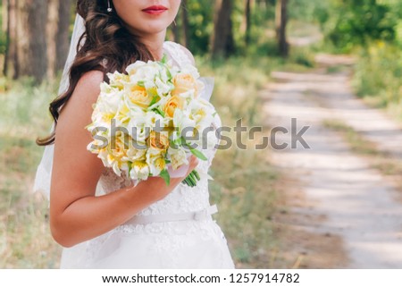 wedding bouquets in the hands of the bride