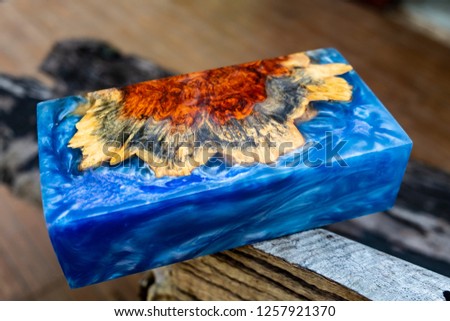 epoxy resin Stabilizing Afzelia burl exotic wood blue background, Abstract art picture photo, print design and your advertisement