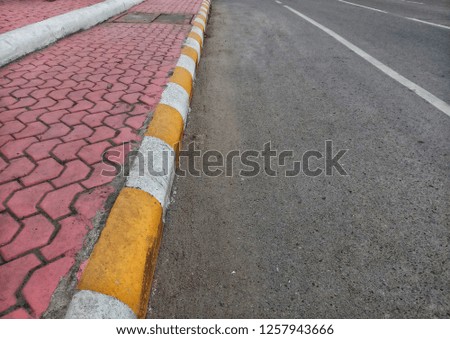 Footpath with yellow traffic line, temporary parking